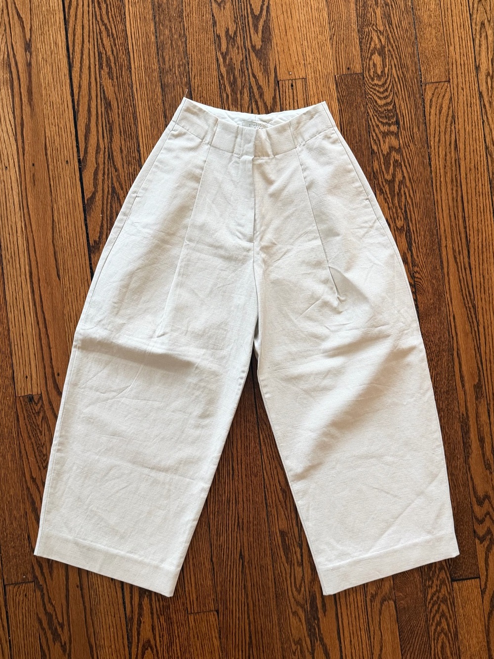 Studio Nicholson High-Waist Wide-Leg Trousers in Cream